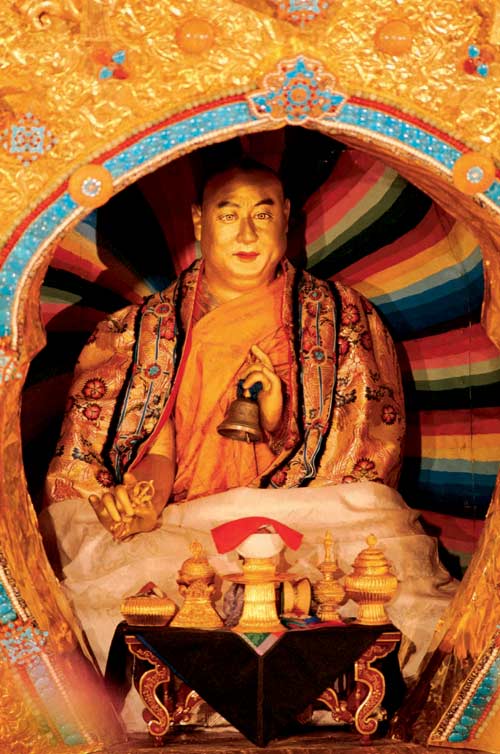 Full length statute of the 10th Panchen Lama in the mourning pagoda. 