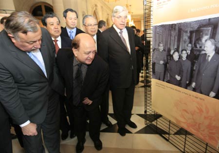 President of France's Senate Gerard Larcher (1st L) and Chairman of France-China Friendship Group Jean Besson (2nd L) look at Chinese pictures at the opening ceremony of a photo exhibition marking the 45th anniversary of the establishment of diplomatic relations between France and China in Paris, France, January 28, 2009. 