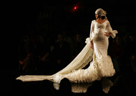 A model presents a creation by designer Hermanas Serrano during the International Flamenco Fashion Show in Seville January 30, 2009.