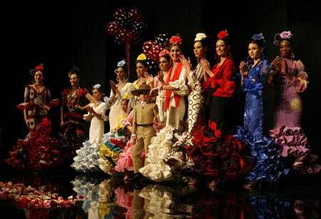 Models present creations from Hermanas Serrano during the International Flamenco Fashion Show in Seville January 30, 2009.