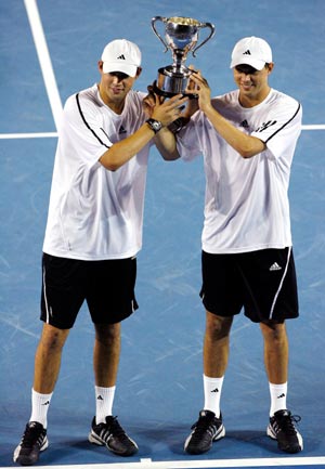 Bob Bryan and Mike Bryan of the United States pose with the trophy during the awarding ceremony for the men's doubles at Australian Open tennis tournament in Melbourne, Jan. 31, 2009. The Bryans defeated India's Mahesh Bhupathi and Bahamas' Mark Knowles 2-1 to win the title. 