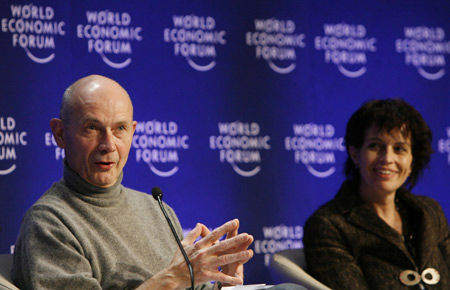 Pascal Lamy (R) Director-General of the World Trade Organization (WTO) gestures next to Doris Leuthard, Swiss Economy Minister, during a session at the World Economic Forum (WEF) in Davos January 31, 2009. 