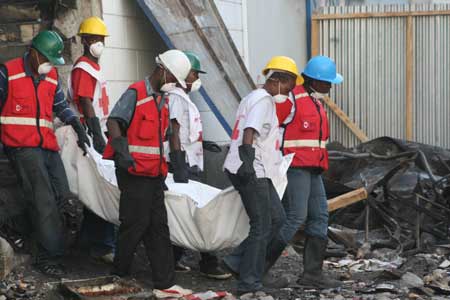 Kenyan Red Cross workers remove bodies in the Nakumatt supermarket in downtown Nairobi, Kenya, on Jan. 30, 2009. 