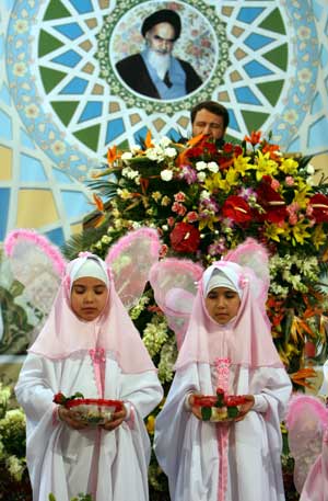 Iranian schoolgirls wearing costumes attend a ceremony held at Khomeini's mausoleum in Tehran, Iran, Jan. 31, 2009.