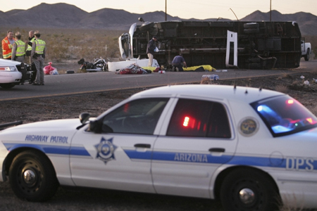 Officials work at the scene of the tour bus accident that left seven Chinese tourists dead on US-93 near Dolan Springs, Arizona Jan. 30, 2009.