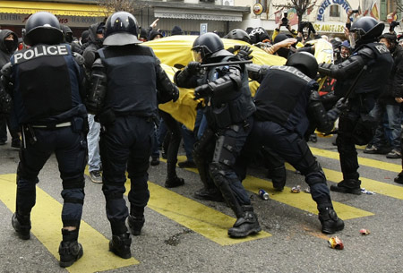 Riot policemen clash with protestors during a demonstration against the Davos World Economic Forum (WEF) in Geneva Jan. 31, 2009. 