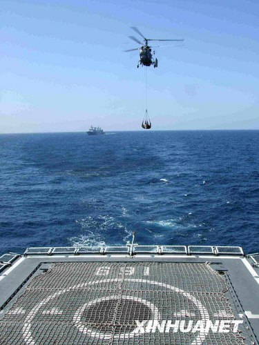 The warship 'Wuhan' used helicopters to distribute fresh fruit and vegetables from Chinese merchant ship 'New Africa' to ships in the Chinese escort fleet on January 31.