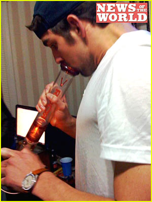 Michael Phelps is smoking marijuana pipe.