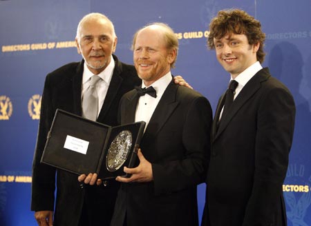 Director Ron Howard (C) holds his nominee plaque as he poses with actors Frank Langella (L) and Michael Sheen from the movie 'Frost/Nixon' at the 61st annual Directors Guild of America Awards in Los Angeles January 31, 2009. 