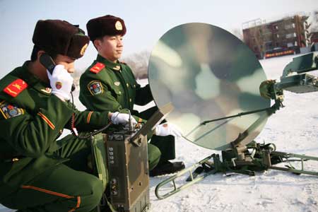 Members of armed police demonstrate the use of communicating facilities during an anti-terrorism drill for the 24th Winter Universiade 2009 in Harbin, captial of northeast China's Heilongjiang Province, Feb. 2, 2009. 