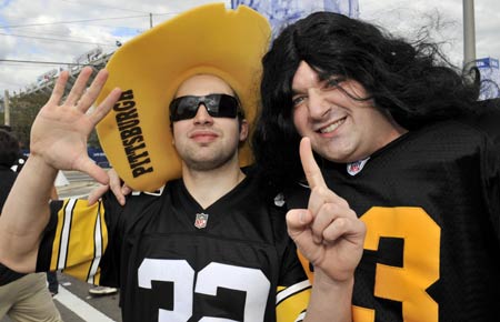 Pittsburgh Steelers fans looking for their 6th Super Bowl hold up six fingers as they arrive for the NFL's Super Bowl XLIII football game in Tampa, Florida February 1, 2009.