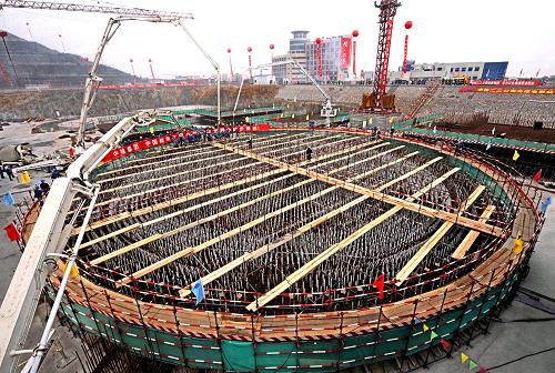 Photo taken Dec. 26, 2008 shows a huge construction site of the expansion project of the two million-kw generating units in the Qinshan Nuclear Power Plant in Haiyan, east China's Zhejiang Province. The two new generating units are scheduled to be completed and put into operation by the year of 2013 and 2014 respectively. [Xinhua]