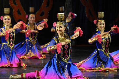 Artists from China&apos;s Central Ensemble of National Minorities Songs and Dances perform at the Egyptian National Theatre in Cairo, capital of Egypt, Feb. 2, 2009. The performance is part of the &apos;Egypt Chinese Art Week&apos;. (Xinhua/Zhang Ning)
