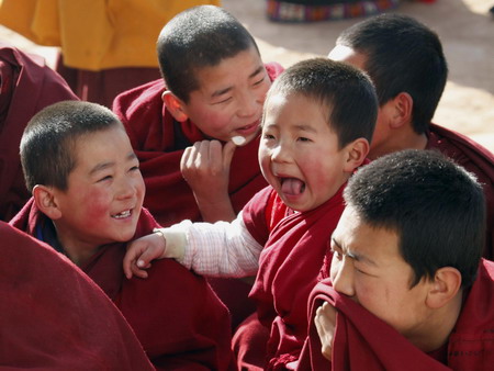 Young ethnic Tibetan monks attend a prayer meeting at a monastery in Tongren, northwest China's Qinghai province Monday, Feb. 2, 2009. (Photo: China Daily)