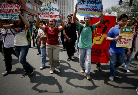 Protestors, mostly students, shout slogans during a rally outside the U.S. embassy in Manila, Philippines, Feb. 3, 2009.