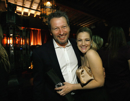 Cast member Drew Barrymore (R) poses with director of the movie Ken Kwapis at the party following premiere of the movie 