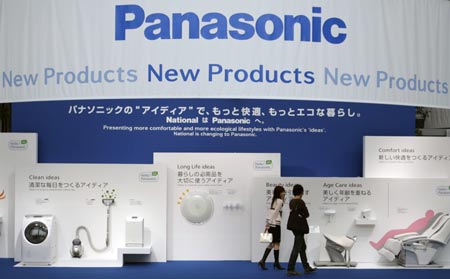 A couple look at electronic products displayed at Panasonic Center showroom in Tokyo September 26, 2008.