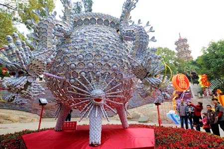 Citizens enjoy a lantern made by 30,000 porcelains in front of China Tower in Mawei of Fuzhou City, southeast China's Fujian Province, Feb. 5, 2009. The 7th lantern show in 2009 with 20,000 hand-made lanterns will take place in Mawei of Chinese mainland and Mazu of southeast China's Taiwan Province at the same time.(Xinhua/Zhang Guojun) 