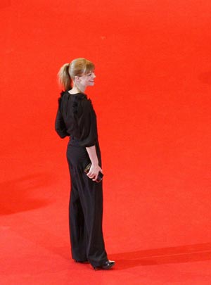 German actress Heike Makatsch poses as she arrives at the red carpet for the screening of the opening film 'The International' at the 59th Berlinale film festival in Berlin February 5, 2009.