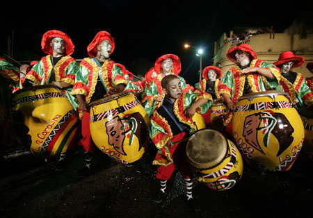 Members of a "comparsa", a carnival band, participate in the "llamadas" parade in Montevideo February 5, 2009. On the first Thursday and Friday of February, thousands of people crowd the capital