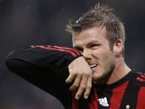 AC Milan's David Beckham rubs his nose during their Italian Serie A soccer match against Reggina at the San siro stadium in Milan February 7, 2009. 