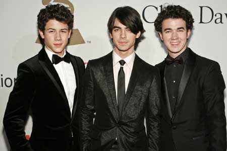 The Jonas Brothers, Nick, Joe, and Kevin (L-R) arrive at the Recording Academy&apos;s Clive Davis pre-Grammy party in Beverly Hills, California Feb. 7, 2009. 