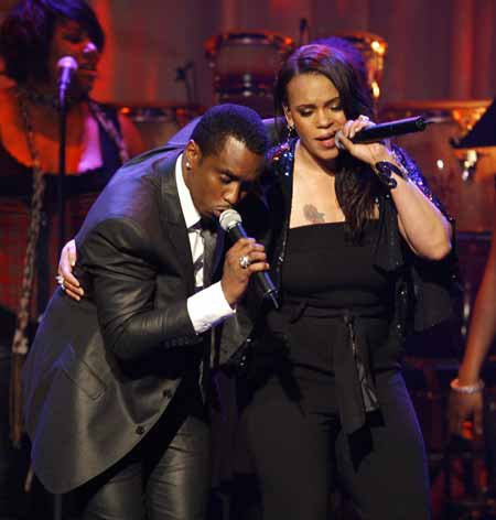 Sean &apos;P. Diddy&apos; Combs (L) and Faith Evans, widow of the Notorious B.I.G., perform at the 2009 Grammy Salute to Industry Icons event honoring Clive Davis in Beverly Hills, California February 7, 2009. 