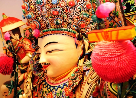 A statue of Buddha made of ghee is displayed at the Taer Monastery in Huangzhong County, northwest China's Qinghai Province, Feb. 8, 2009. 