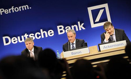 Josef Ackermann (right), CEO of Deutsche Bank, addresses the audience at the annual news conference in Frankfurt, central Germany, Thursday, Feb. 5, 2009. Deutsche Bank AG confirmed Thursday that a hefty euro 4.8 billion (6.1 billion U.S. dollars) net loss in the fourth quarter resulted in a shortfall for the full year.(Xinhua/AFP Photo)