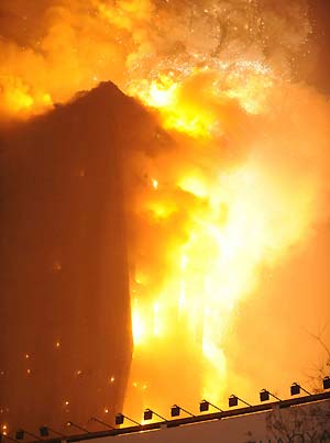 The photo taken on Feb. 9, 2009 shows the ablaze north wing building of the new CCTV (China Central Television) headquarters in Beijing, capital of China. A fire broke out on Monday night at the building, namely Mandarin Oriental Hotel, which is about hundreds of meters away from the new CCTV main tower in east Beijing.