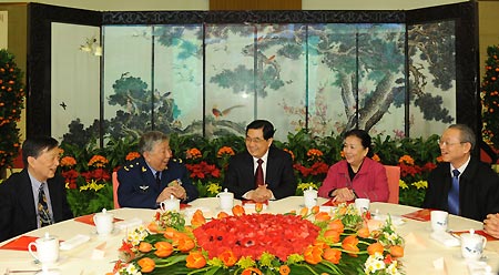 General Secretary of the Central Committee of the Communist Party of China (CPC) Hu Jintao (C) talks with delegates from the intelligentsia during a get-together marking the traditional Lantern Festival at the Great Hall of the People in Beijing, capital of China, Feb. 9, 2009. The CPC Central Committee hosted a get-together here on Monday to mark the Lantern Festival.