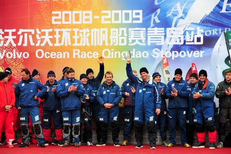 Crew members of Ericsson 4 skippered by Torben Grael of Brazil celebrate after winning the in-port race of the Volvo Ocean Race 2008-09 in Qingdao Feb. 9, 2009. 