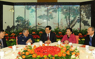 General Secretary of the Central Committee of the Communist Party of China (CPC) Hu Jintao (C) talks with delegates from the intelligentsia during a get-together marking the traditional Lantern Festival at the Great Hall of the People in Beijing, capital of China, Feb. 9, 2009. The CPC Central Committee hosted a get-together here on Monday to mark the Lantern Festival.