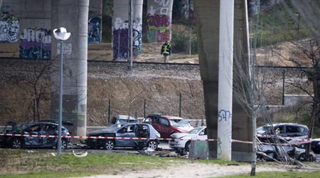 Police investigate the scene of a car bomb in Madrid February 9, 2009.