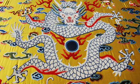 Photo taken on Feb. 10. 2009 shows a dragon on a piece of Chinese brocade decorated with some 180,000 pearls, each 1.3mm in diameter, at Suzhou City in east China's Jiangsu Province. 