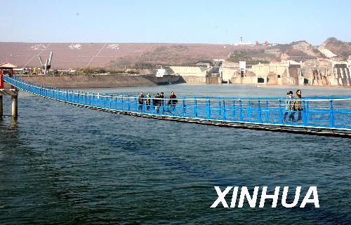 Water is brought to parched croplands by increasing the flow from dams and water-diversion channels in the lower reaches of the Yellow River. 