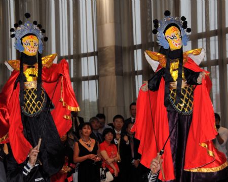 Puppet show performers from southwest China's Sichuan Province play Chinese puppets during a Lantern Festival celebration in Wellington, capital of New Zealand, Feb. 10, 2009. The traditional Chinese Lantern Festival falls on the 15th day of the first month of the Chinese lunar calendar, or Feb. 9 this year. (Xinhua/Huang Xingwei) 