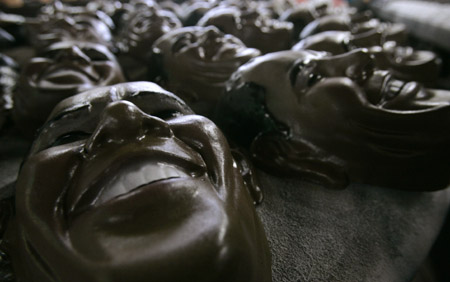 Masks made in the likeness of U.S. President Barack Obama lie on an assembly line at a costume factory in a suburb of Rio de Janeiro February 10, 2009.