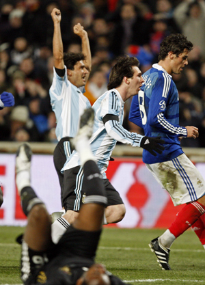 Argentina's Lionel Messi (C) reacts after scoring against France during their international friendly soccer match at the Velodrome stadium in Marseille February 11, 2009. 