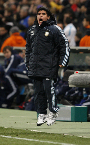 Argentina's head coach Diego Maradona reacts after Lionel Messi scored against France during their international friendly soccer match at the Velodrome stadium in Marseille February 11, 2009. 