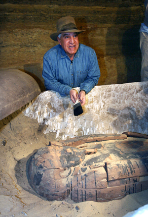 Zahi Hawass, Secretary General of the Egyptian Supreme Council of Antiquities, introduces a wooden coffin for journalists at Saqqara, 30 km south of Cairo, capital of Egypt, on Feb. 11, 2009. Zahi Hawass opened here on Wednesday a limestone sarcophagus that had been sealed by the Pharaohs for 2600 years. This sarcophagus was found inside a burial chamber 11 meters below the ground, which contained another 30 mummies, wooden coffins, and limestone sarcophagi. (Xinhua/Mike Nelson)