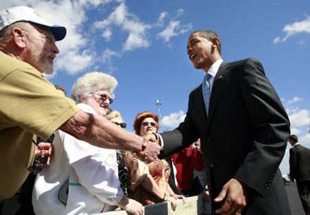 U.S. President Barack Obama greets wellwishers upon his arrival at MacDill Air Force Base in Fort Myers, Florida, February 10, 2009. Obama travelled to Fort Myers to push for his administration's economic stimulus package.