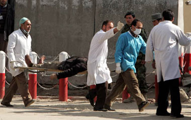 Afghan medics carry a wounded man from the Justice Ministry after suicide bombers attacked the building in Kabul, capital of Afghanistan, on Feb. 11, 2009. A series of terrorism attacks targeting several government buildings Wednesday morning killed at least 19 people and wounded 54 others, according to Public Health Ministry spokesman Abdul Fahim. The Taliban has claimed responsibility for the attacks.
