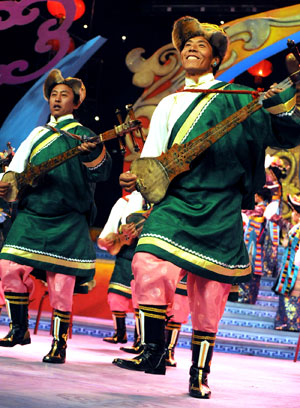 Tibetan farmers perform during a dress rehearsal of the evening party held by Lhasa TV station for the upcoming new year of Tibetan calendar which falls on Feb. 25, in Lhasa, capital of southwest China's Tibet Autonomous Region, Feb. 10, 2009. 