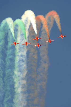 An Indian aerobatics team performs during the opening ceremony of an airshow in Bangalore, India, Feb. 11, 2009. 