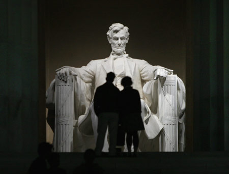 A couple share a moment during their visit to the Abraham Lincoln Memorial after midnight in Washington February 12, 2009. The United States celebrates the 200th anniversary of the birth of America's civil war president, Abraham Lincoln, on Thursday. 