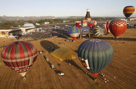 Hot air balloons take off during the start of the 14th Philippine International Hot Air Balloon Week at Clark airbase in Pampanga province, north of Manila, February 12, 2009.