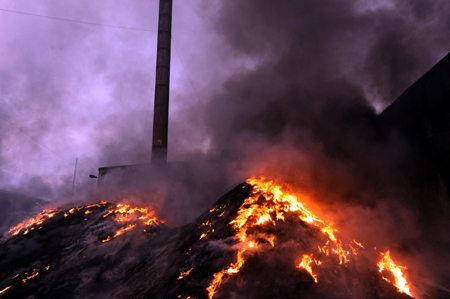 Flame of embers is seen in Shaxian County of Sanming City, 270 km. from Fuzhou, capital of southeast China's Fujian province, Feb. 13, 2009. 