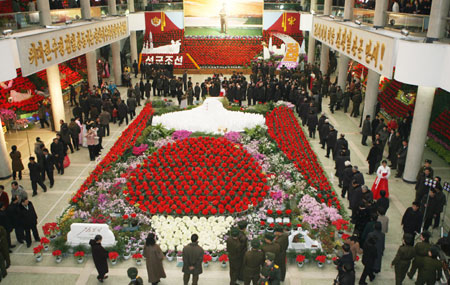 People visit an exhibition on 'Kim Jong Il flowers' held in Pyongyang, capital of the Democratic People's Republic of Korea (DPRK), Feb. 14, 2009. The exhibition was held to celebrate the upcoming 67th birthday of DPRK top leader Kim Jong Il. [Xinhua] 