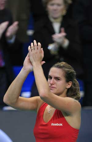 Amelie Mauresmo of France celebrates after winning the final match over Elena Dementieva of Russia in the Paris Open tennis tournament in Paris, France, Feb. 15, 2009. 